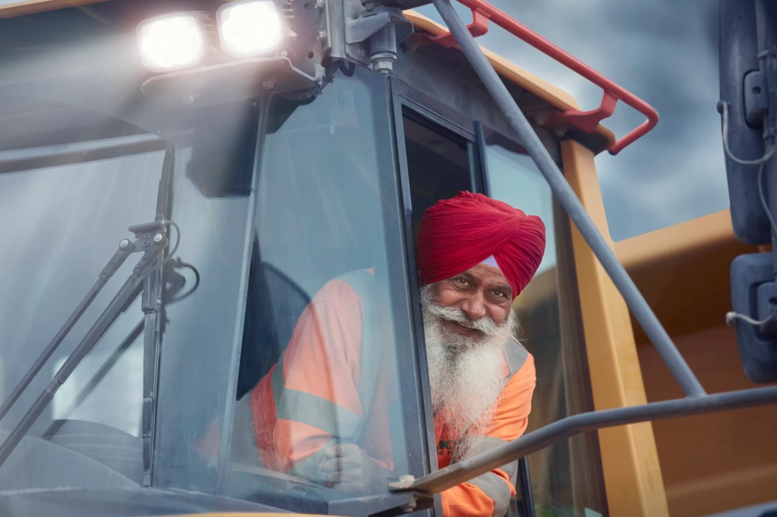 Dumper driver smiling from his cab