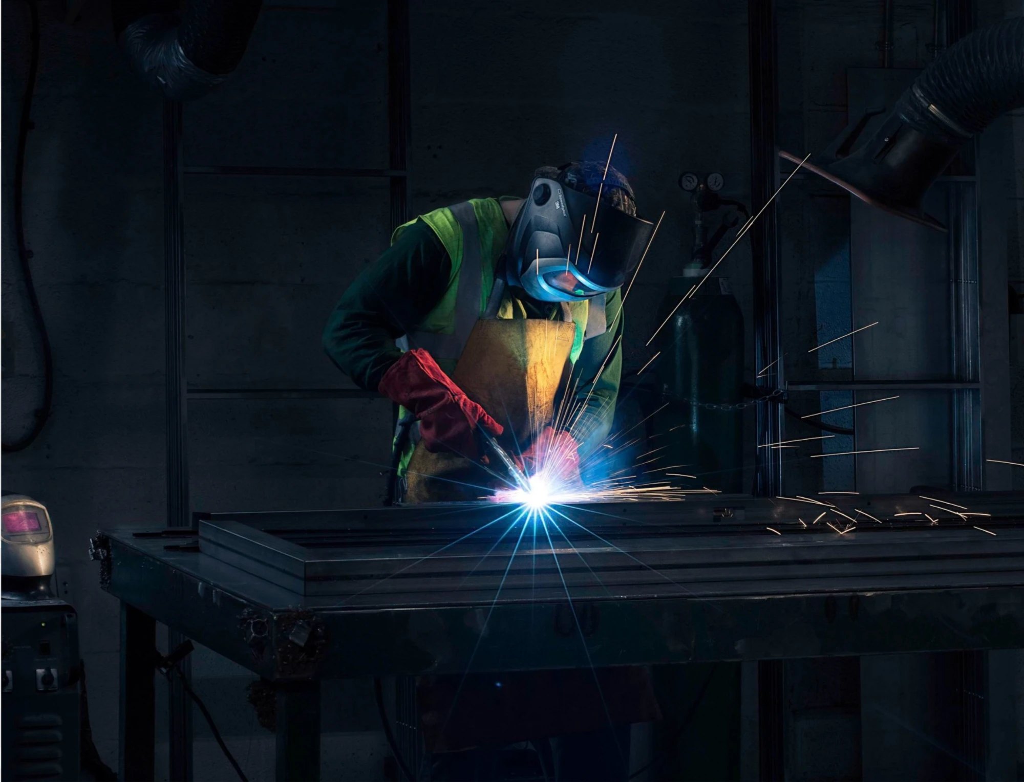 Welder at work in a fabrication shop